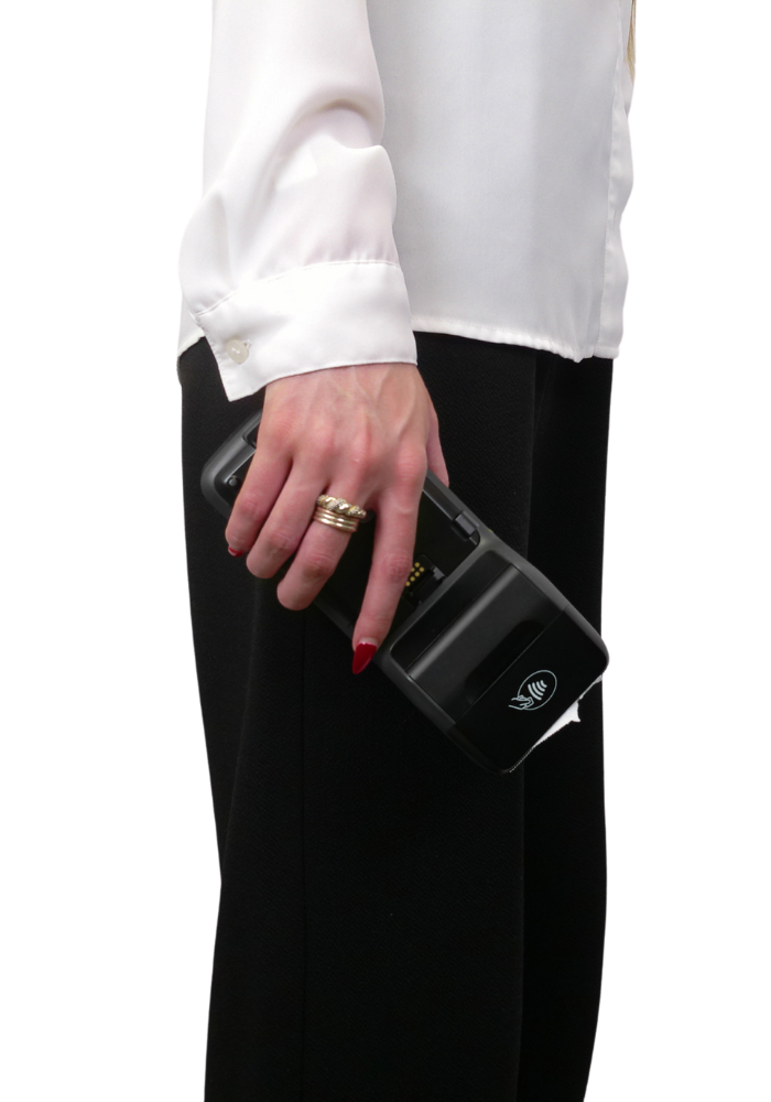 Person holding a credit card terminal for payment.